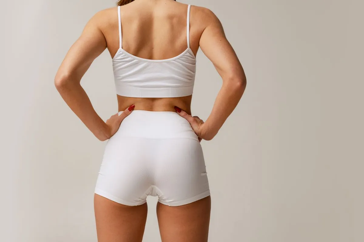 Precise fat transfer during Brazilian Butt Lift surgery by Dr. Ulas Bali, creating fuller, proportional buttocks.