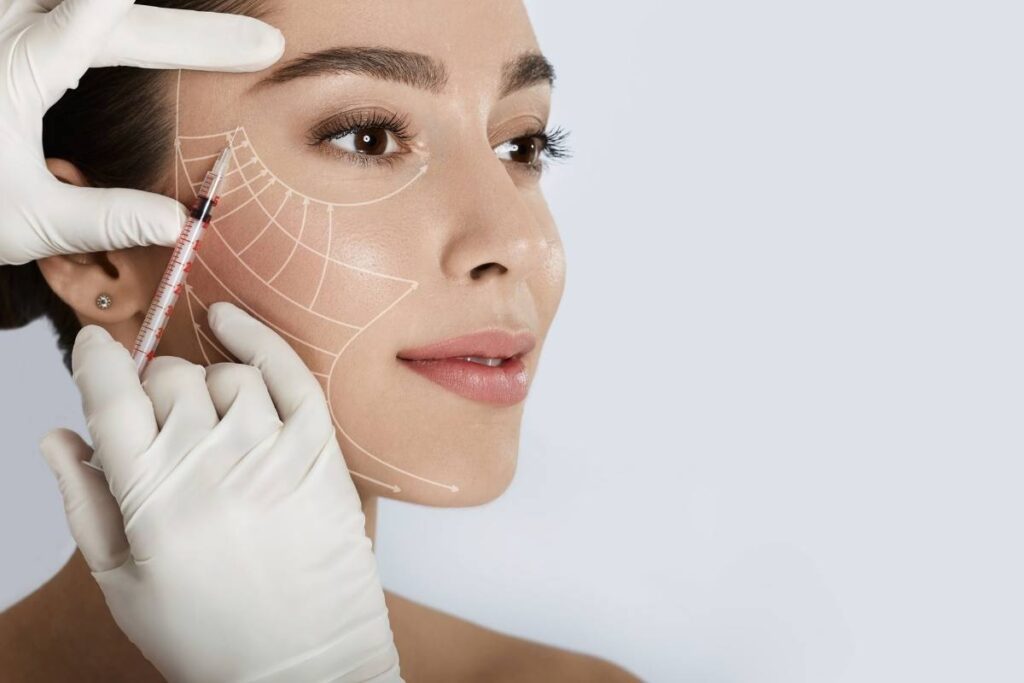 Dr. Ulaş Bali performing facelift surgery to enhance facial contours and rejuvenate skin for a youthful appearance.