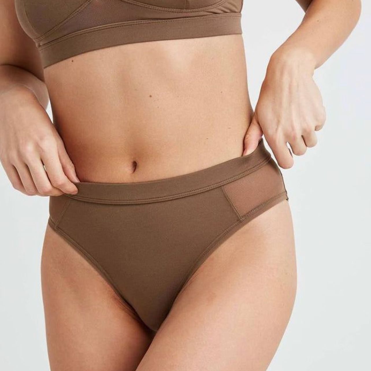 Dr. Ulaş Bali sculpting body contours with precision liposuction, removing stubborn fat for a slimmer appearance.