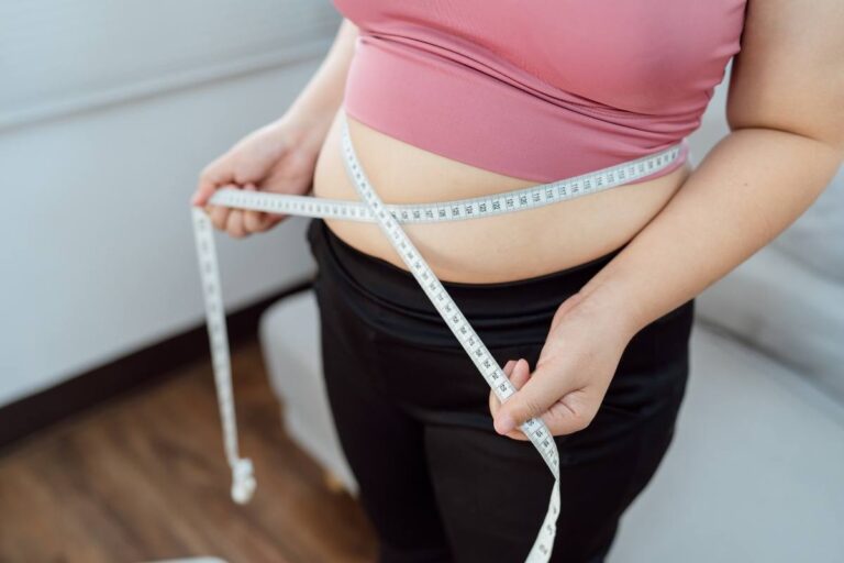 Before and after results of belly fat removal showing a sculpted waistline.