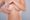 Plastic surgeon consulting patient using 3D imaging before breast lift and augmentation.